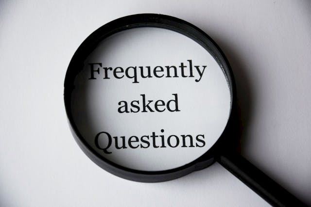 An image of a magnifying glass over text that reads "Frequently asked Questions".